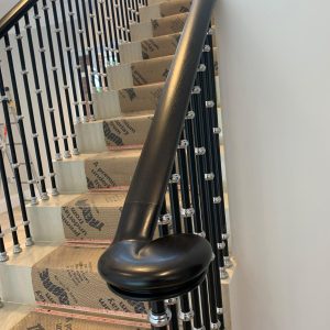 Residential Walnut handrail stripped & ebonised black